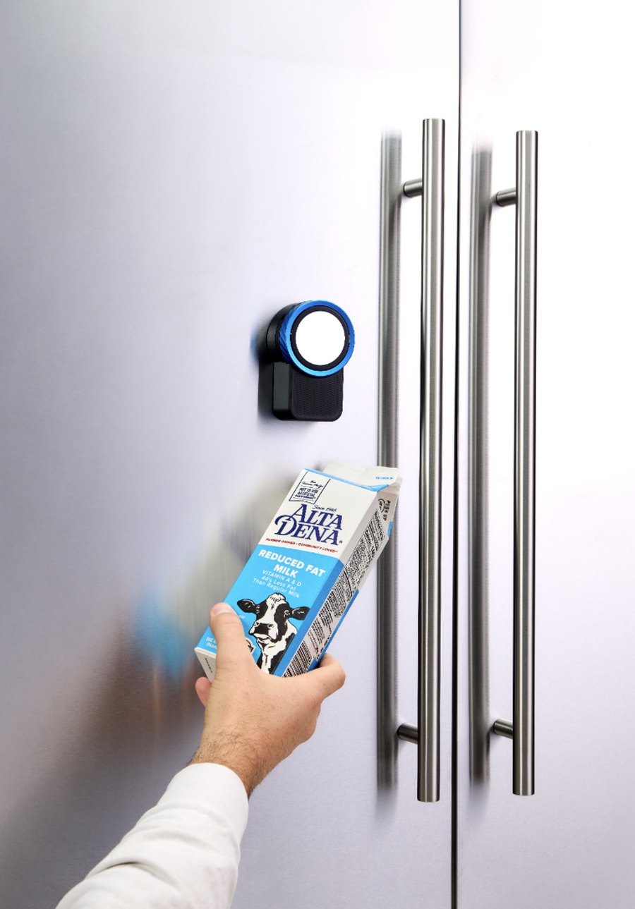 Scanning the last of the milk at the Trepo Halo to reorder it